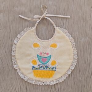 Vintage hqndmade pale yellow bib with bunny & white eyelet trim